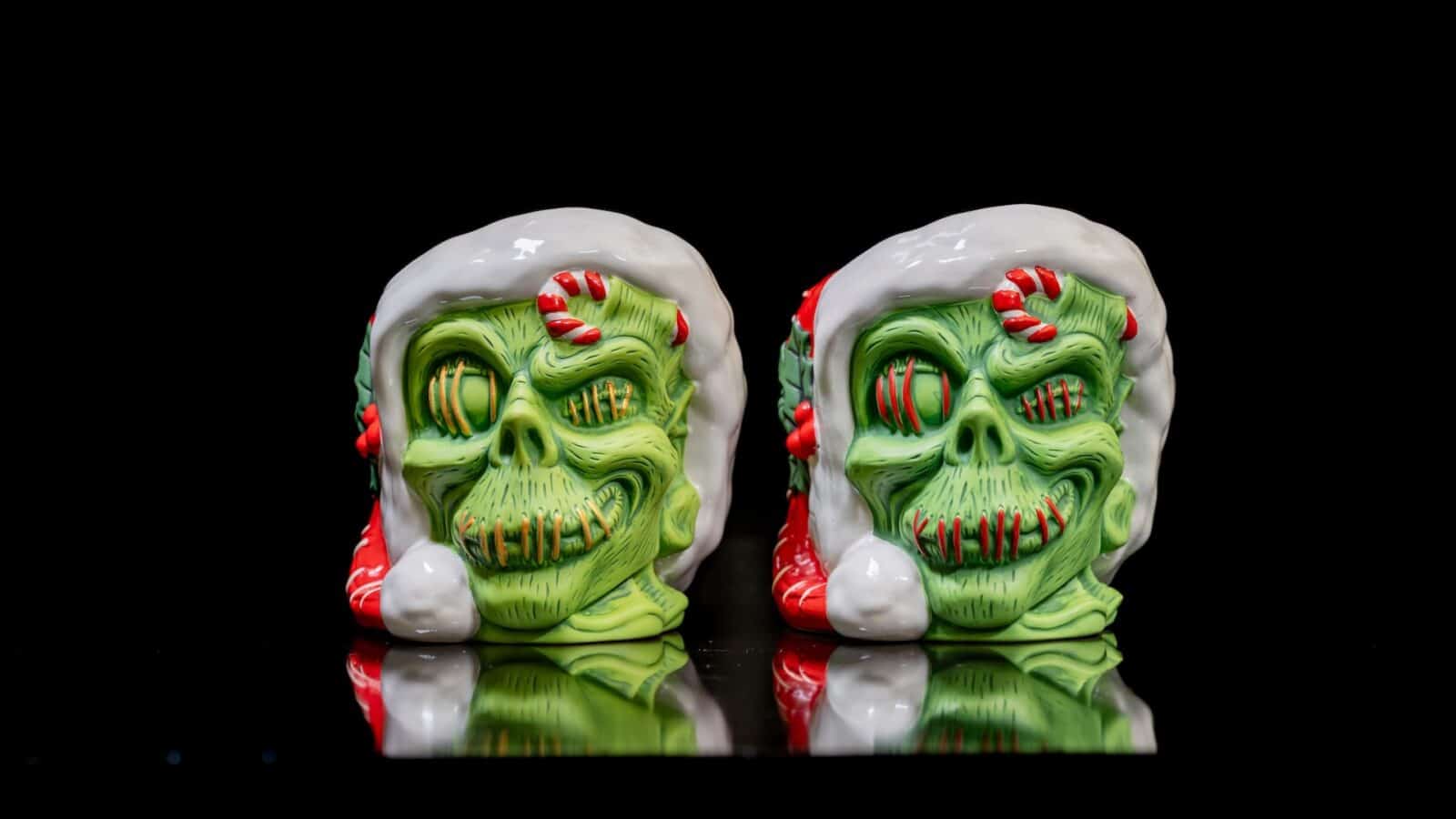 Trader Sams Enchanted Tiki Bar Holiday Zombie Mug and Trader Sams Grog Grotto Holiday Zombie Mug 
