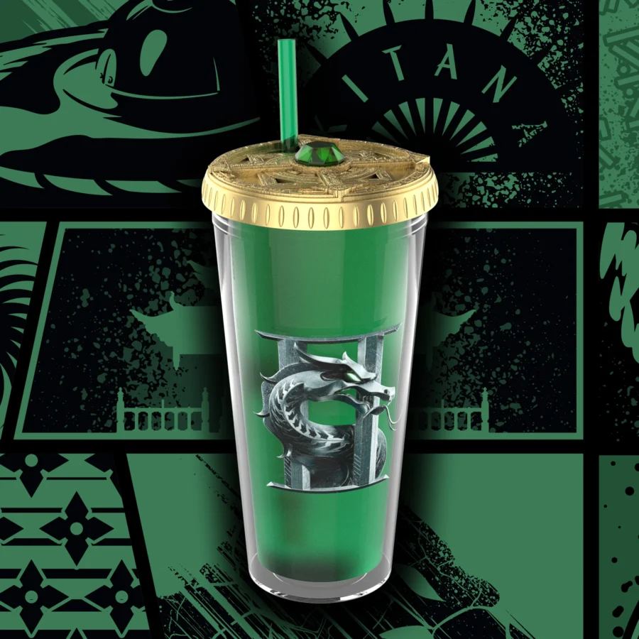 Green tumbler with a gold lid and green straw featuring a silver dragon emblem on the side