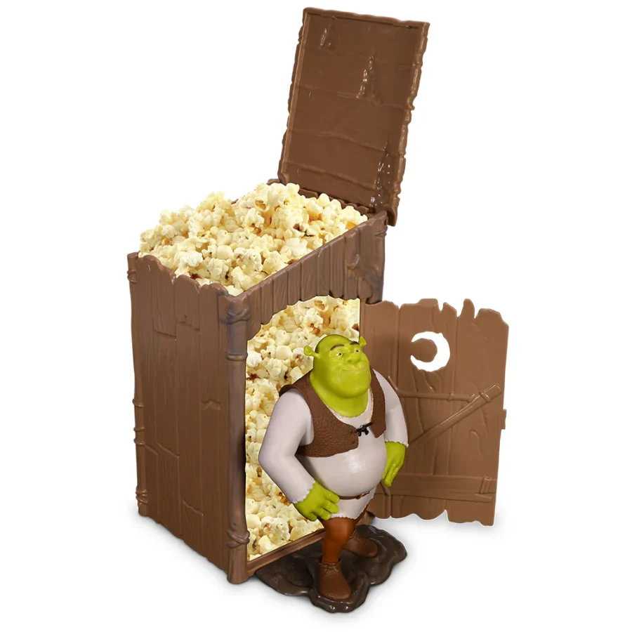 Shrek figurine beside a brown chocolate themed popcorn container with its lid open and popcorn overflowing from inside