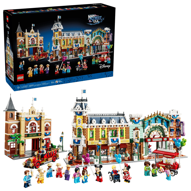 Boxed LEGO Disney Main Street USA set featuring colorful town buildings and minifigures shown with an assembled storefront layout and miniature characters in front