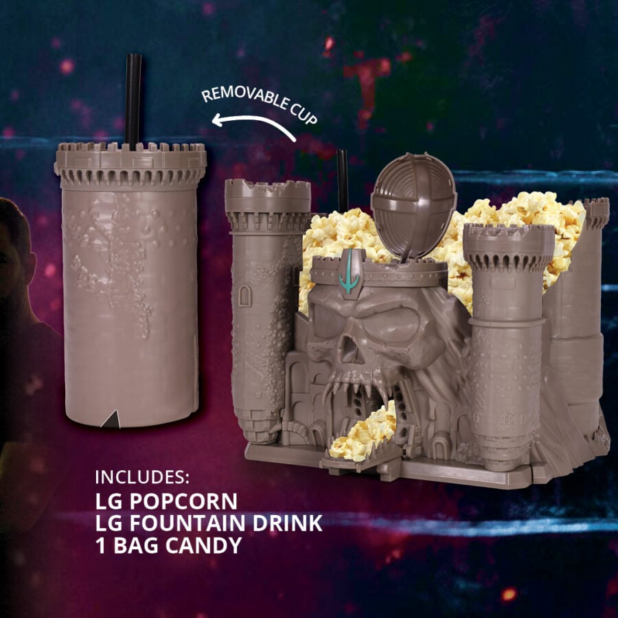 Castleshaped toy fortress with popcorn spilling from a tunnel mouth and a removable cup on top set against a colorful backdrop Promo text lists included items