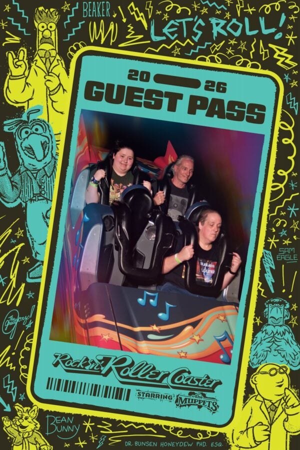 Colorful poster border with Muppets style doodles showing two riders on a roller coaster ride with Guest Pass and Lets Roll text on the frame