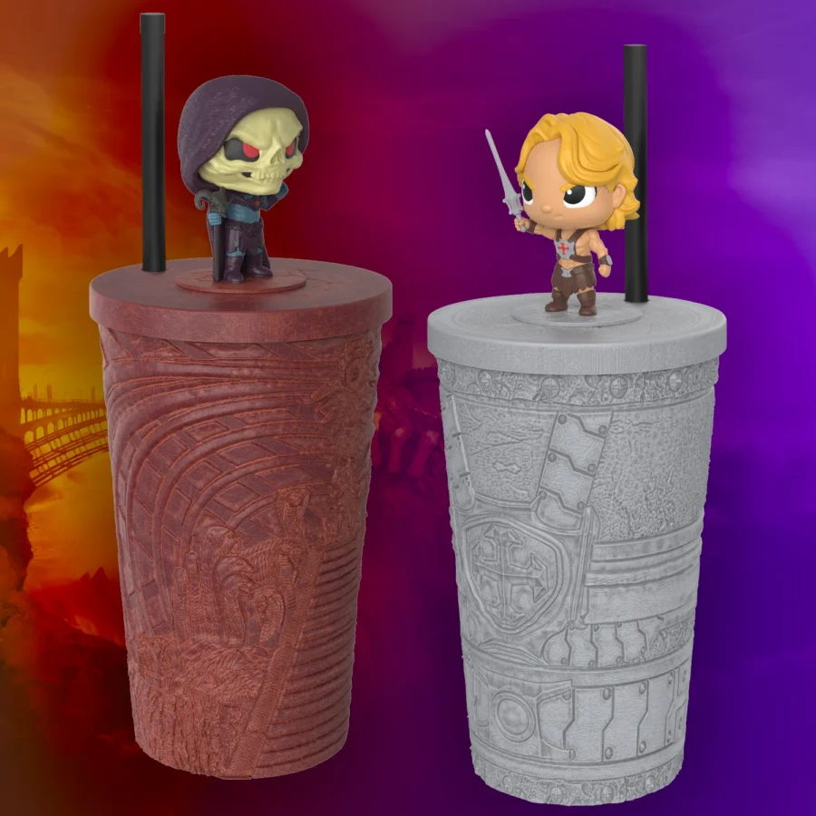 MOTUTOTEMCUPSETHERO Fantasy Land News Two chibi figures stand on carved textured cups a hooded skeleton on a red cup and a blonde warrior with a sword on a gray cup against a purple orange gradient