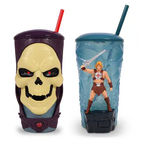 MOTUTumbler1778534442196 Fantasy Land News Two toy cups left purple cup with large yellow skull and red straw right blue cup with He Man figure and sword