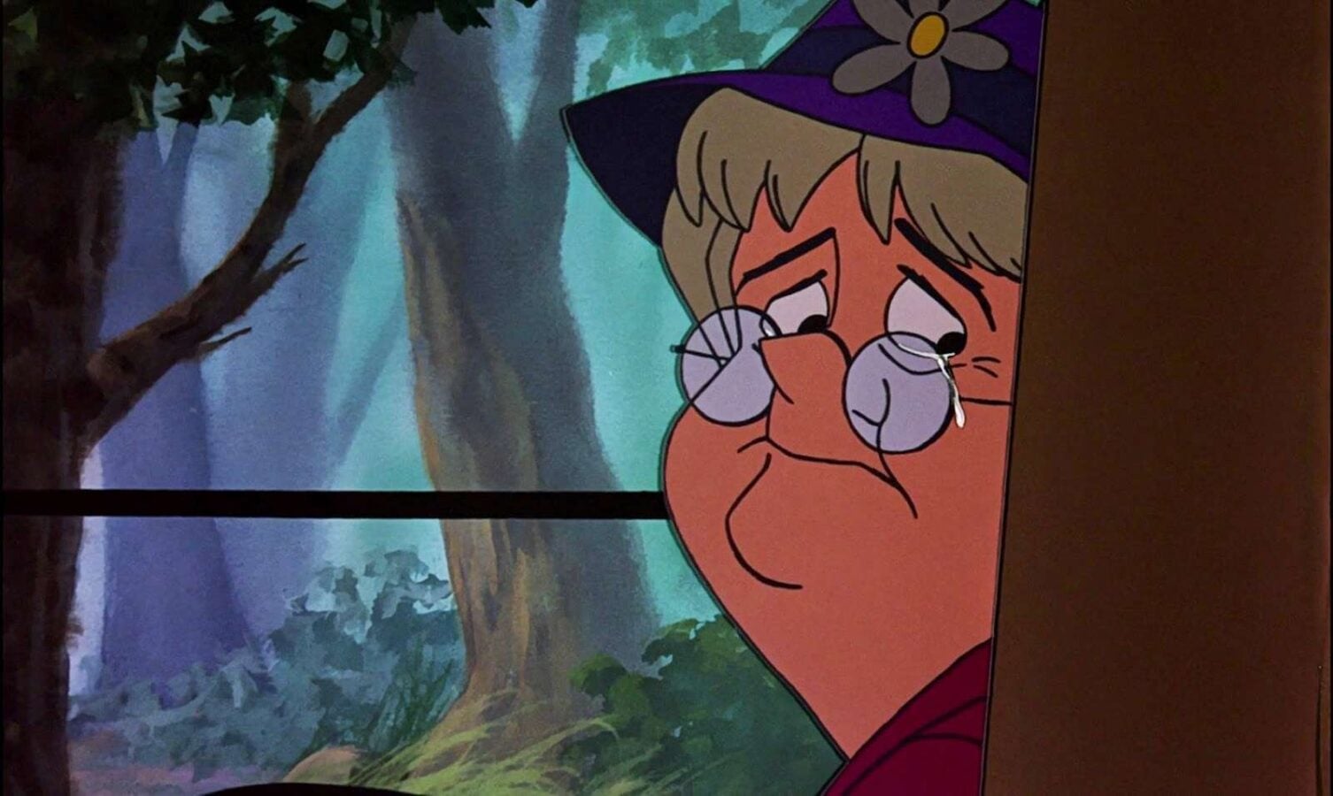 Cartoon character peeking from behind a wall in a forest wearing round glasses and a purple hat with a flower