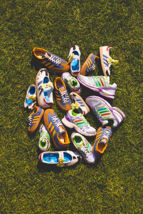 adidas x Toy Story 10 Fantasy Land News Colorful kids sneakers arranged in a circle on green grass field