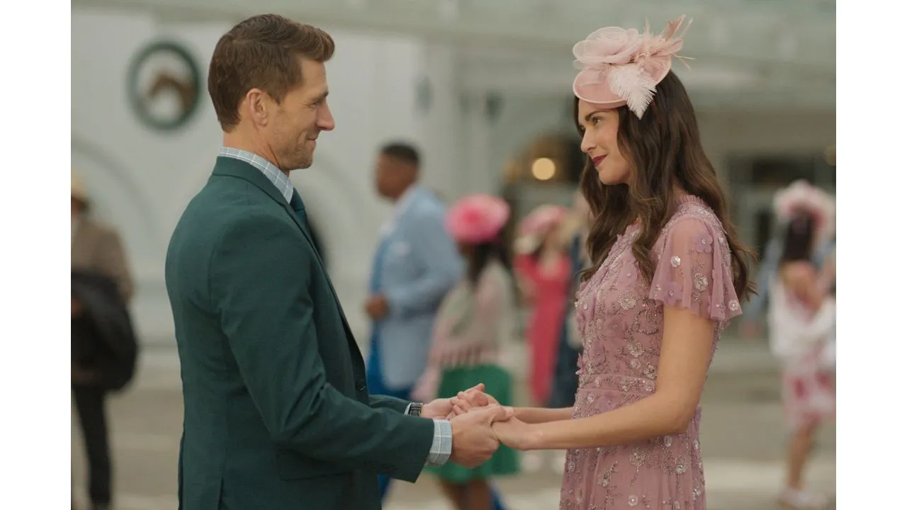 Couple dancing or sharing a moment at a formal event holding hands and facing each other