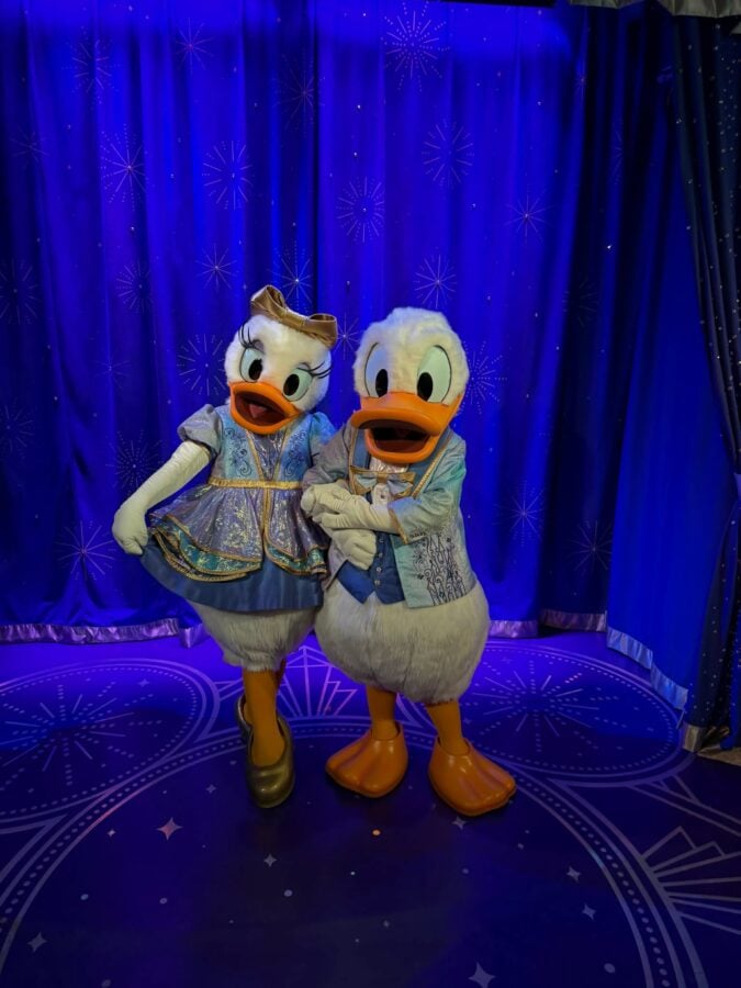 71729708417860032761022825262621806432515563n Fantasy Land News Two duck mascots in matching blue costumes pose together on a blue starry stage backdrop