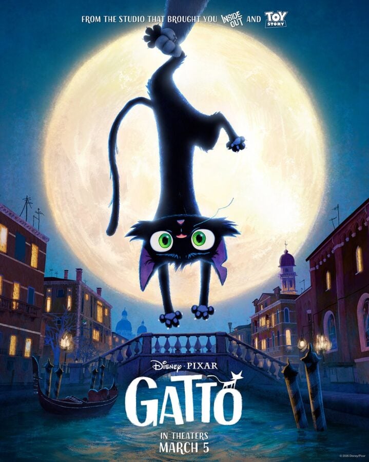 HKix2Y0aIAAA0jK Fantasy Land News Frowning black cat hangs upside down by its tail in front of a huge moon over a canal city street promoting the movie Gato DisneyPixar