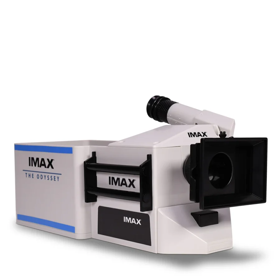 ImaxPB1781281579167 Fantasy Land News IMAX The Odyssey film projector with a large front lens and blue accents on a white body