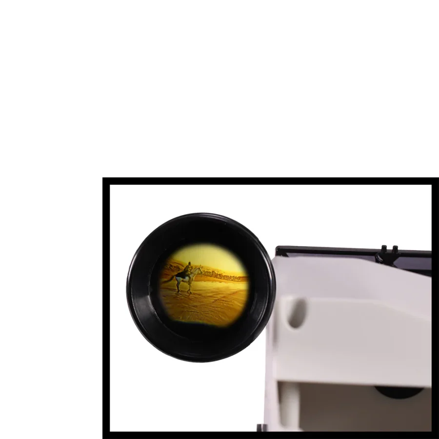 ImaxPB61781281578488 Fantasy Land News Close up of a telescope eyepiece reflecting a desert scene with a camel in the lens edge edge of the frame