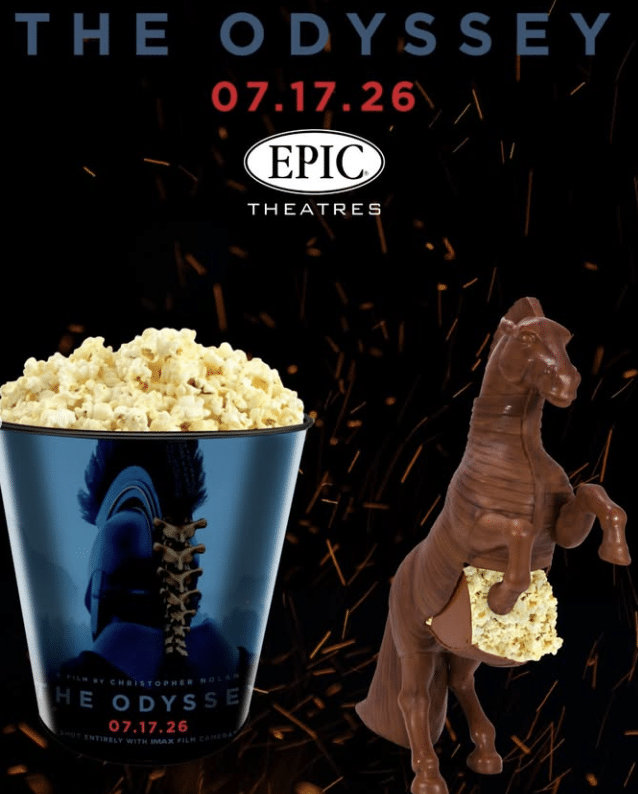 Promotional poster for The Odyssey at Epic Theatres popcorn bucket featuring the film cup a chocolate Trojan horse with popcorn sparks in the dark background and the release date 071726
