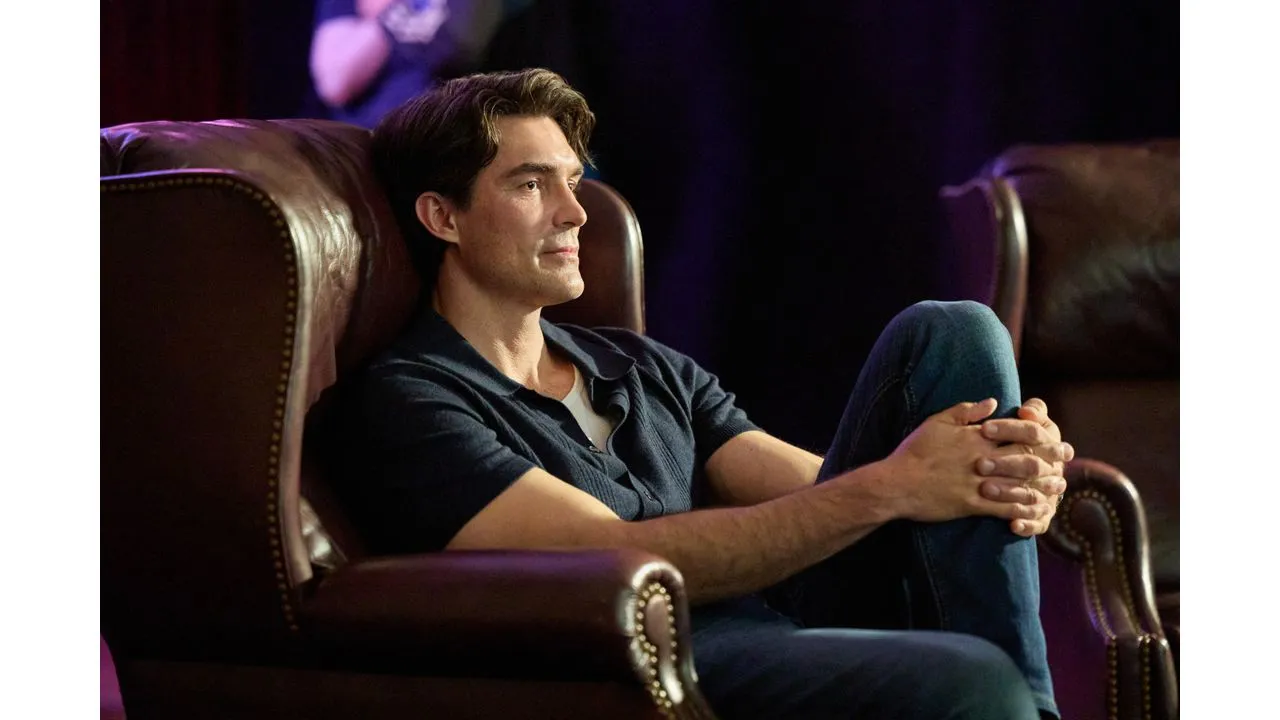 loveheist4 Fantasy Land News Man relaxing in a brown leather armchair arms folded over his knees and gaze to the side