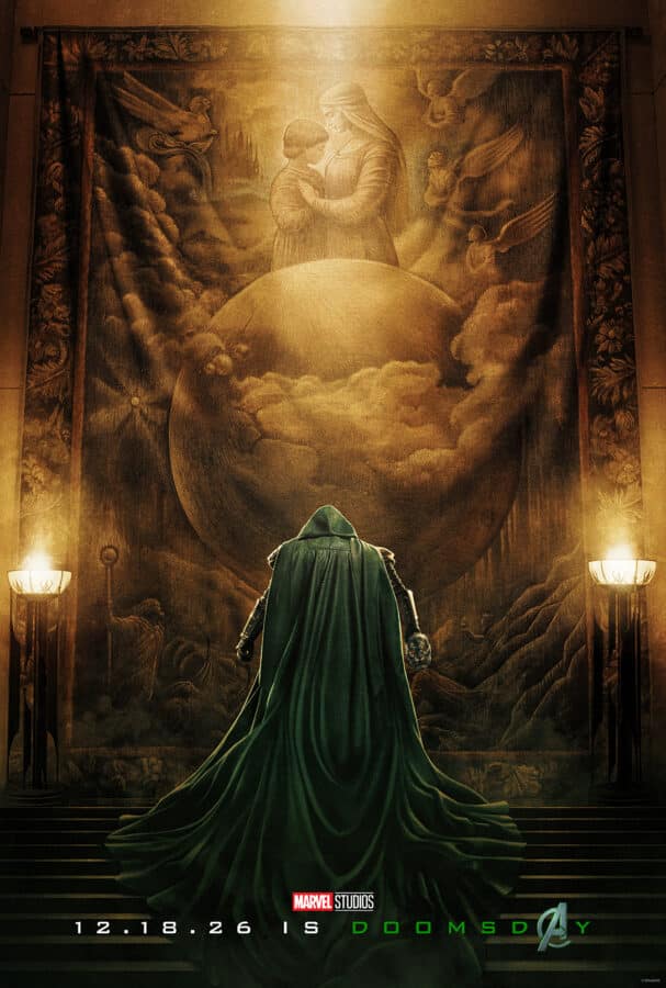 Hooded figure in a long green cape stands with back to viewer facing a giant mural glowing in warm light