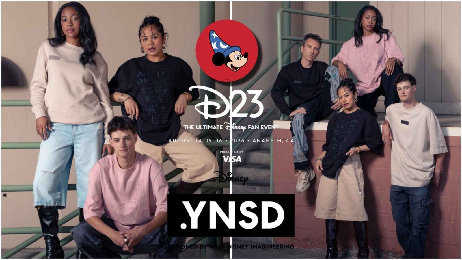 Group of diverse young adults posing on stairs for a D23 Disney fan event banner featuring a red Mickey logo and large YNSD text with Anaheim 2026 details