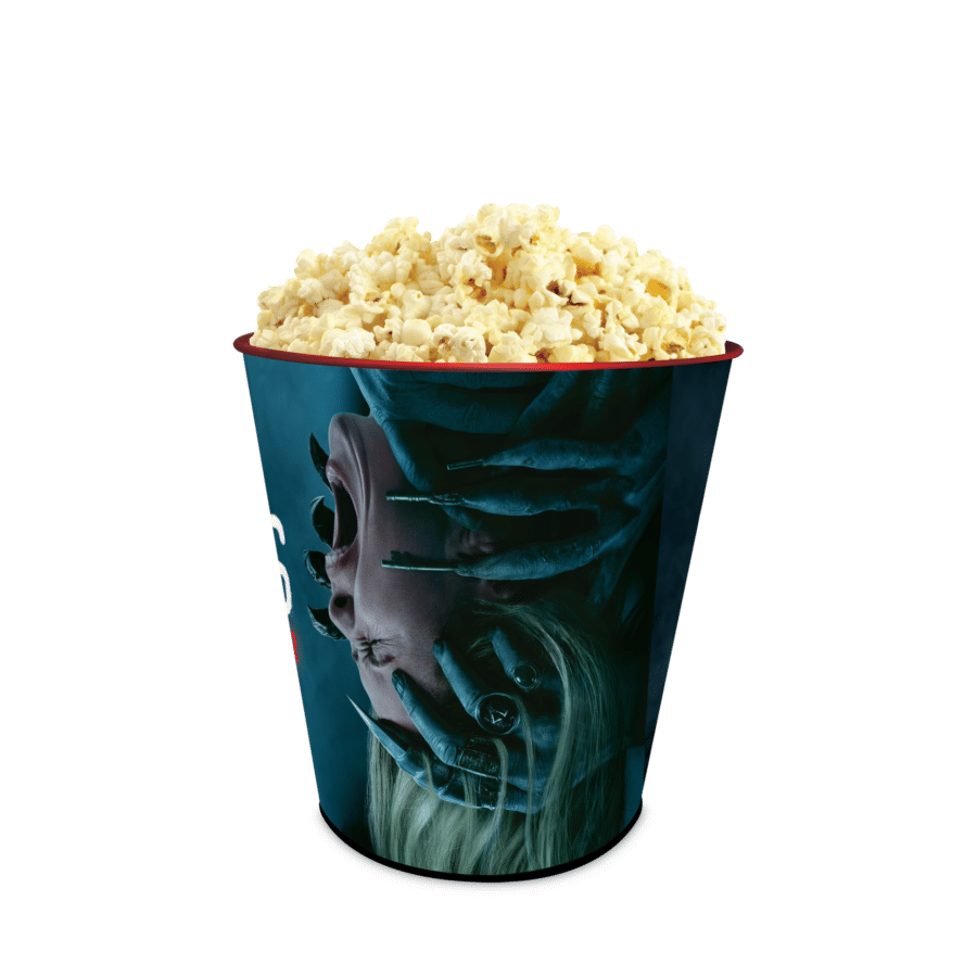 Popcorn overflowing from a blue turred tub against a green background