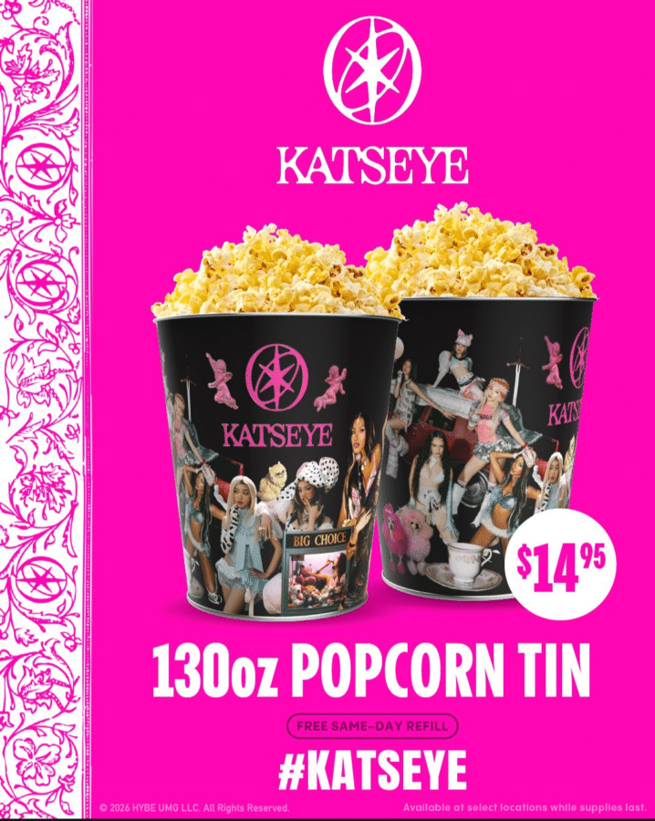 Two black KatEye popcorn tins overflowing with popcorn on a hot pink background price 95 reads 130oz Popcorn Tin and KATSEYE