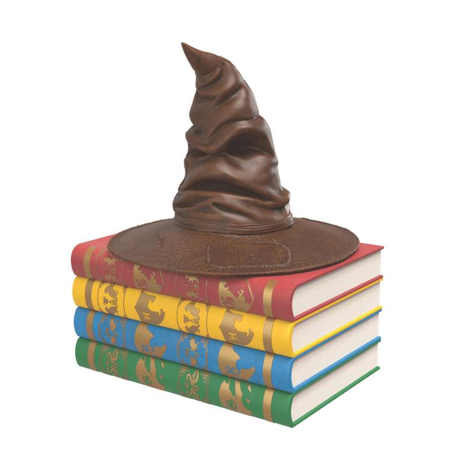 Stack of five colorful hardcover books with a swirled chocolate sculpture on top