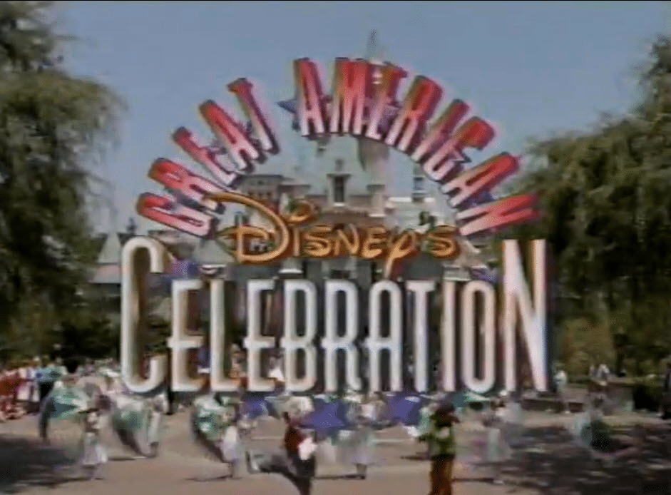 Entrance to a Disney theme park featuring a large arch reading Disneys Celebration with people walking in the foreground
