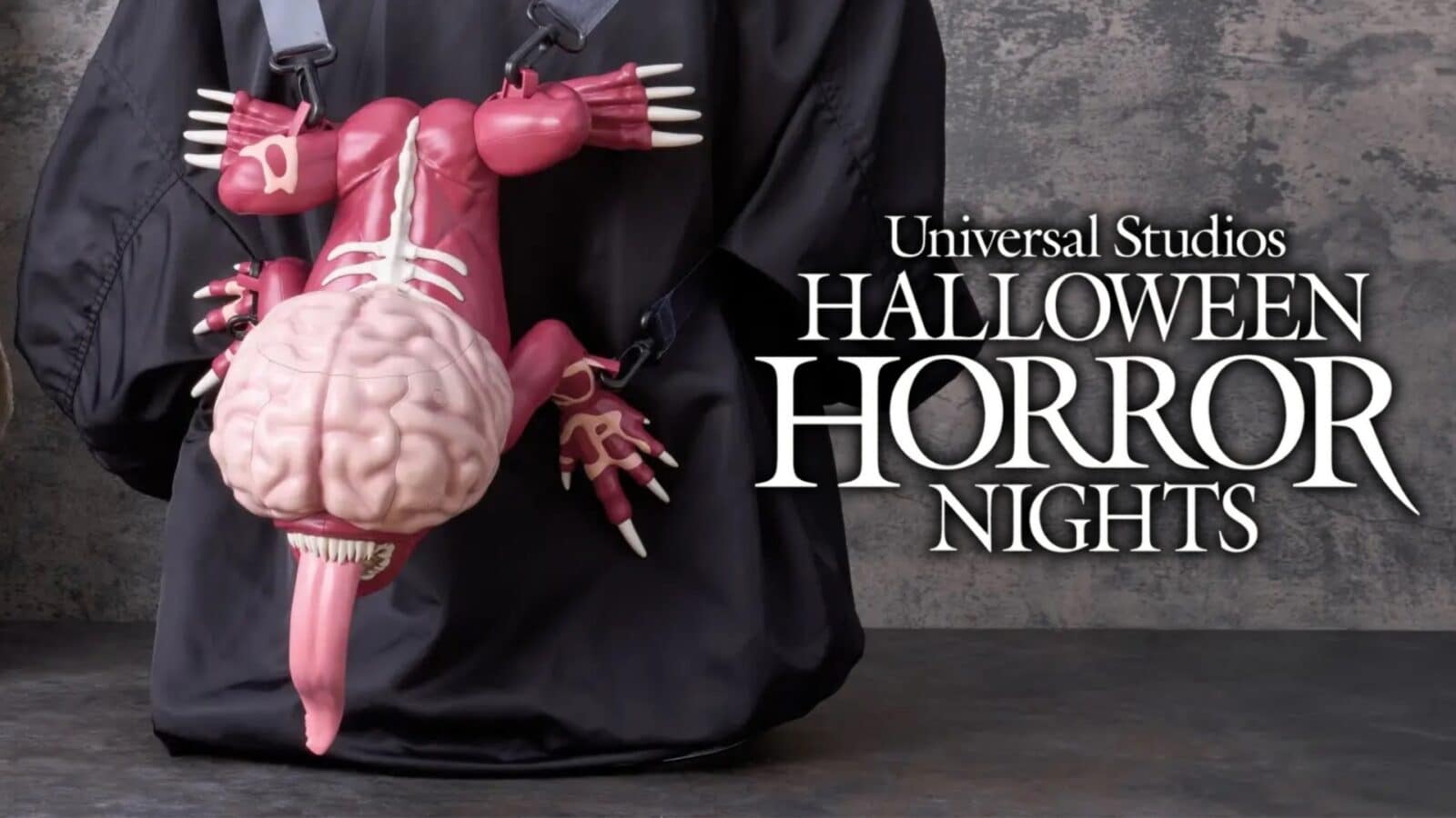 Promotional banner for Universal Studios Halloween Horror Nights featuring a pink plastic anatomy model against a dark background