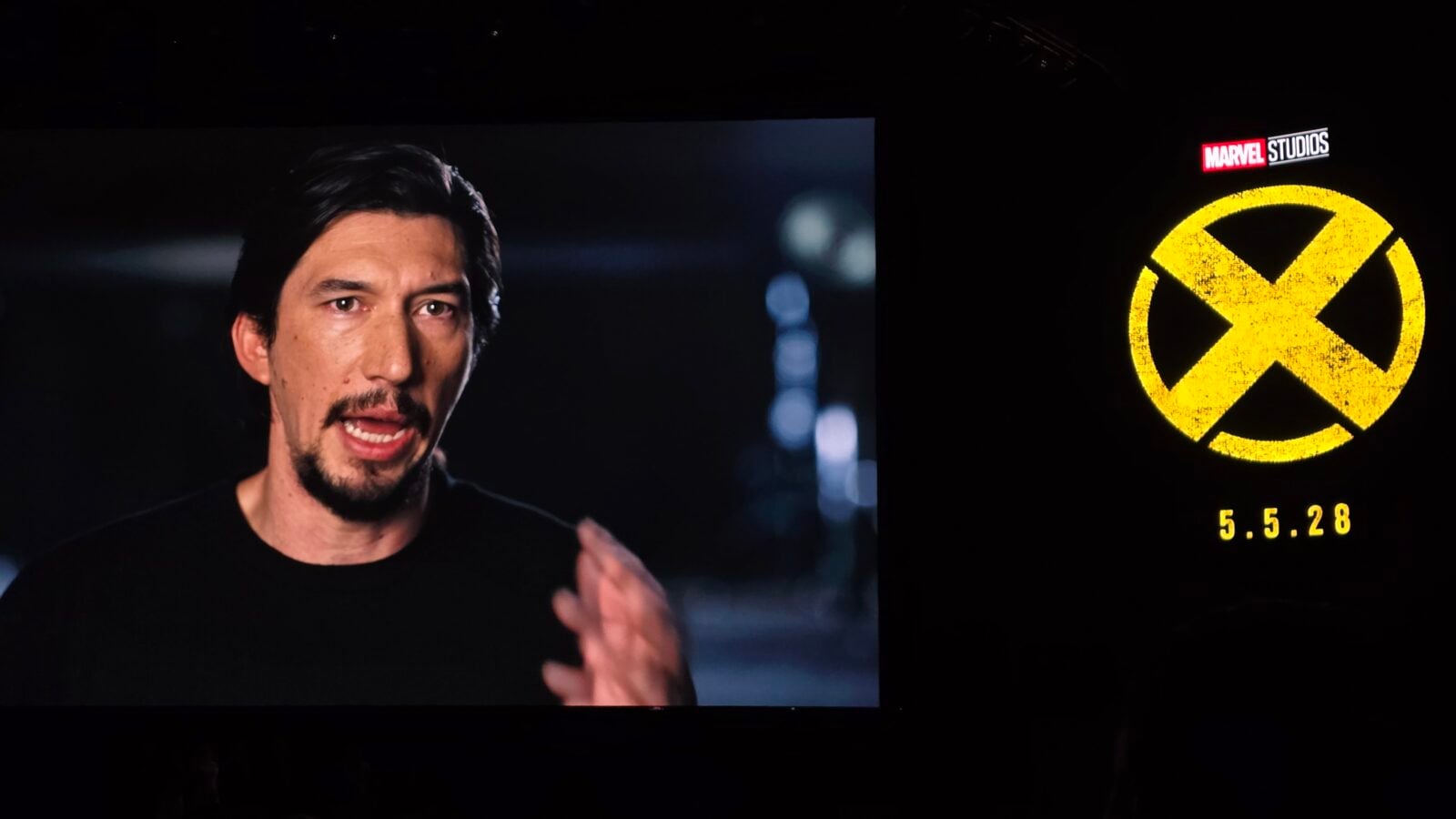 Left shows a man speaking in a dark setting right displays a bright yellow X logo with Marvel Studios branding and the date 5528