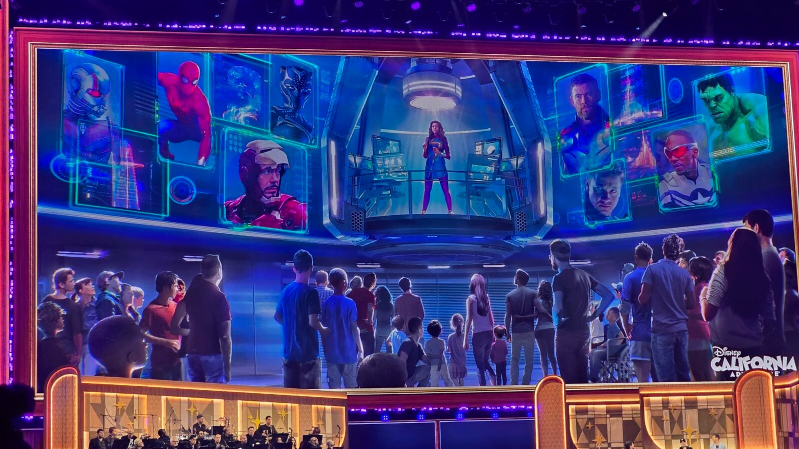 Large sci fi stage mural with a woman presenting on a central platform surrounded by holographic screens showing various superheroes a crowd watches below
