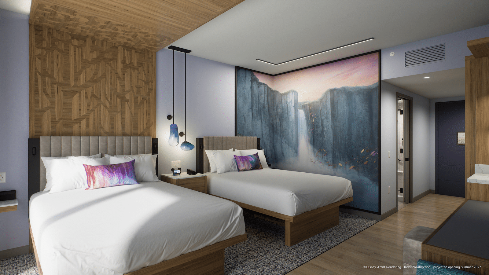 Two queen beds with tufted headboards a waterfall mural on the far wall and pendant lights between them