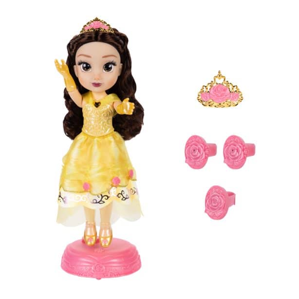 Princess toy doll in a yellow gown on a pink stand with a crown and pink rose accessories nearby