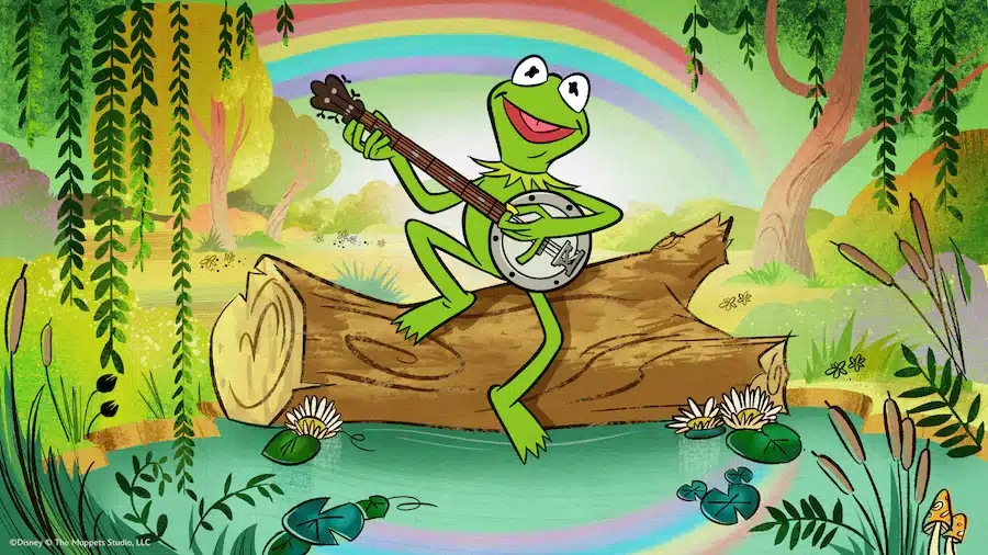 Q3MagnetKermitPushImage1920x1080 Fantasy Land News Kermit the Frog on a log playing a banjo by a pond with a rainbow in a green forest setting