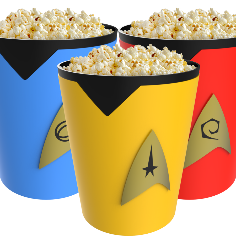 Three colorful buckets filled with popcorn overflowing set against a bright blue and red background