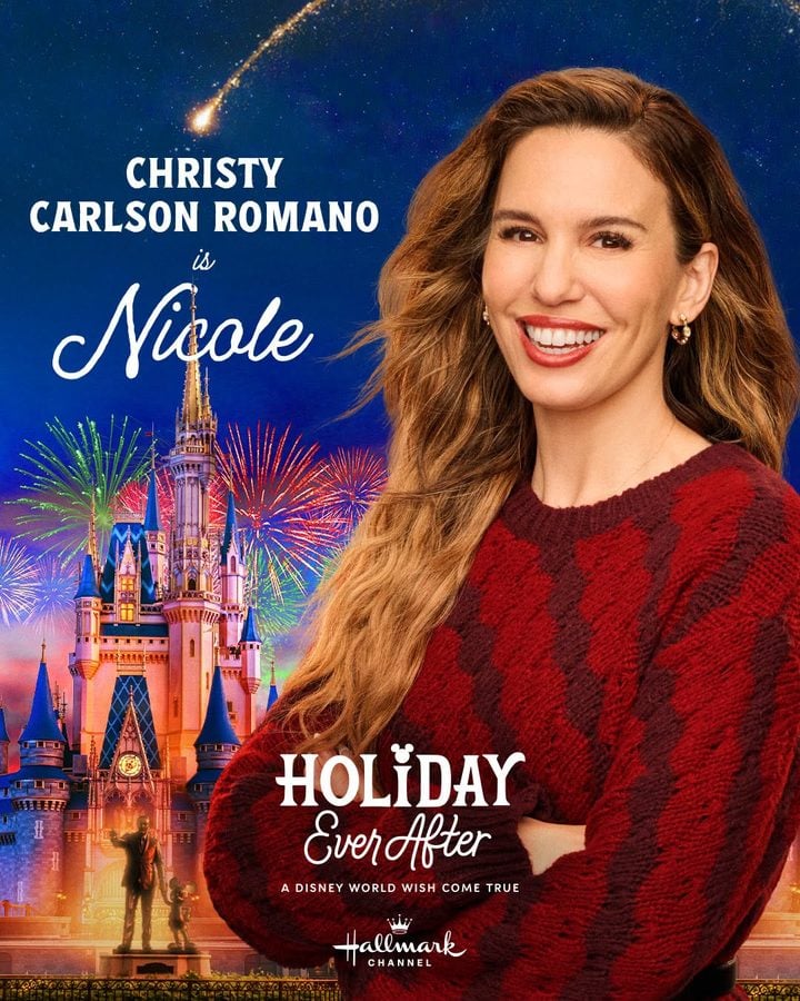 Promotional poster featuring a smiling woman in a red knit sweater with a Disney castle and fireworks in the background for Holiday Ever After