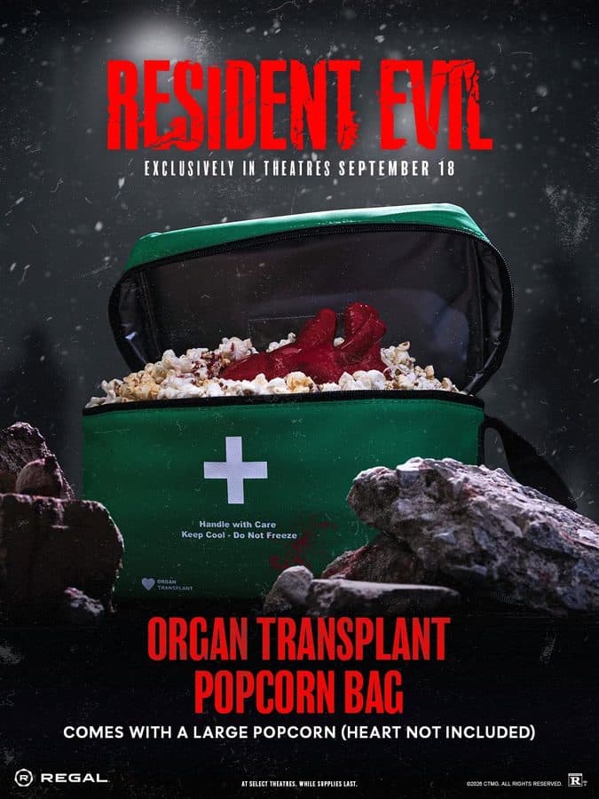 Promotional poster for Resident Evil a green medical bag filled with popcorn and a red heart inside set against a dark snowy backdrop