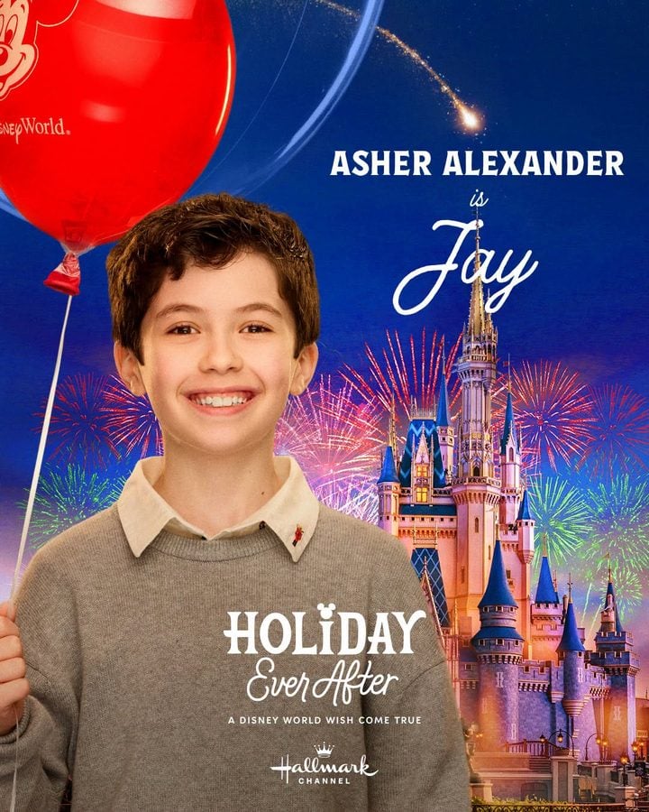 Smiling boy holding a red balloon in front of a Disney World poster with a castle and colorful fireworks