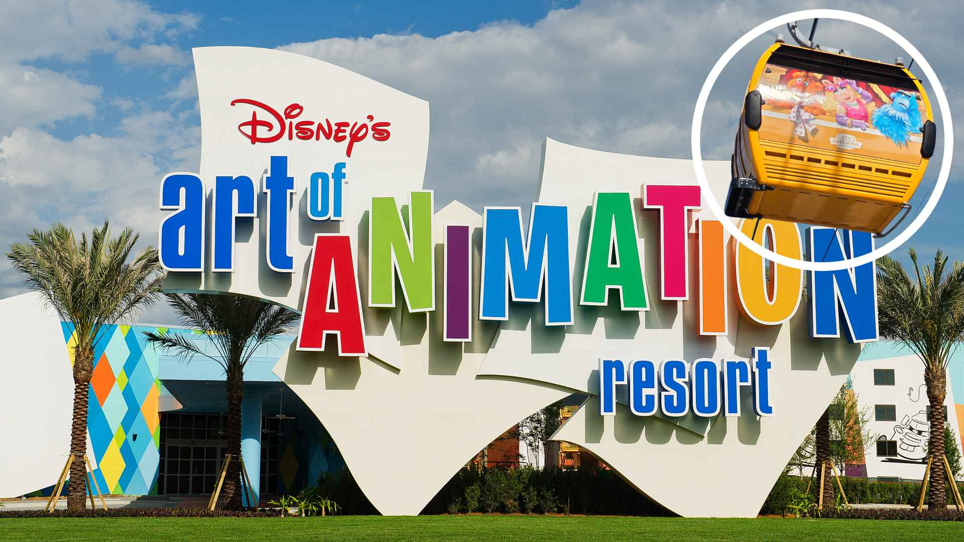 Exterior sign for Disney's Art of Animation Resort with large multicolored letters and palm trees in the foreground.