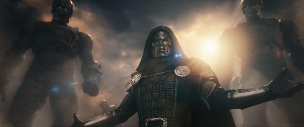 Masked hooded villain in dark armor with a metallic faceplate stands center glowing eyes flanked by helmeted figures in a smoky cinematic scene