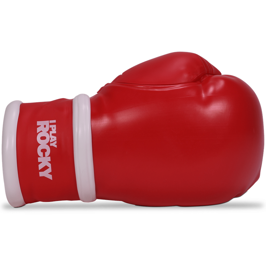 Close up of a red boxing glove with a white wrist strap resting on a dark surface brand text partially visible