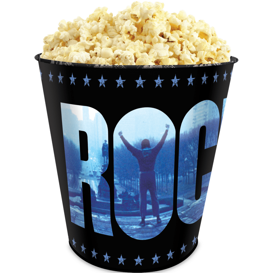 Popcorn overflowing from a black movie theater bucket with blue star pattern and the word BOOM partially visible at the bottom edge