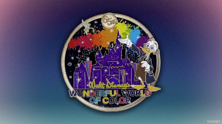 Disney pin celebrating 55th anniversary with a rainbow splashed night sky over a purple castle and a cartoon character waving a wand text reads Walt Disney Wonderful World of Color