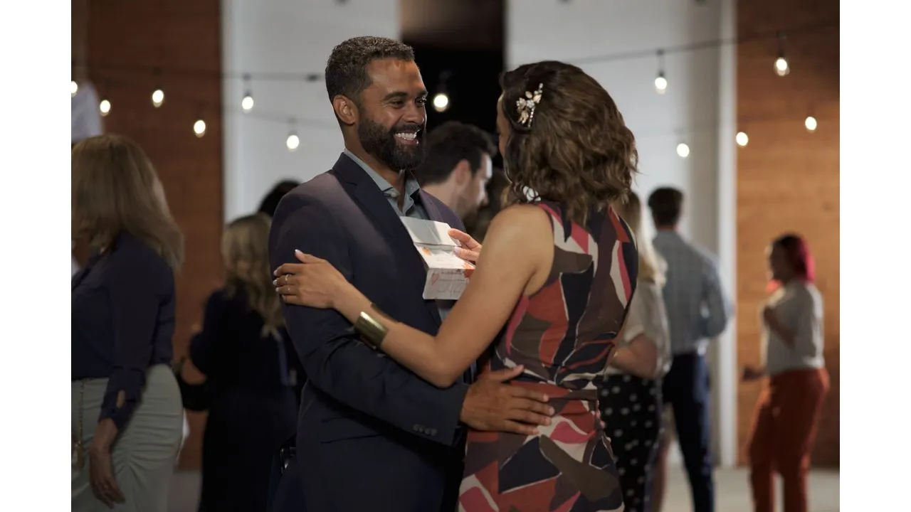 fallplace4 Fantasy Land News Couple dancing at a reception the man in a dark suit smiling as he holds the woman in a colorful patterned dress