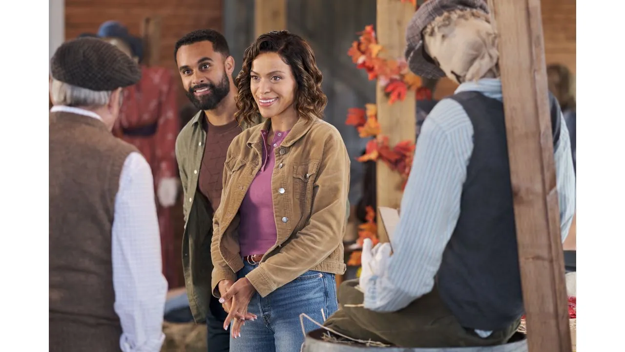 fallplace5 Fantasy Land News Woman in a brown corduroy jacket smiles while standing with a man at a market stall
