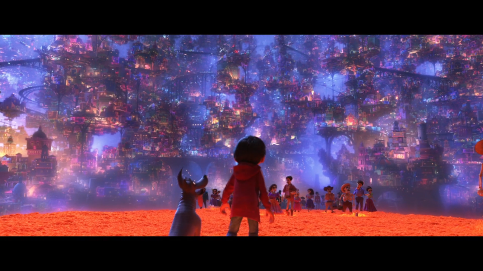 A boy in a red jacket and a blue dog face a vast neon lit fantasy cityscape filled with colorful towers and floating platforms