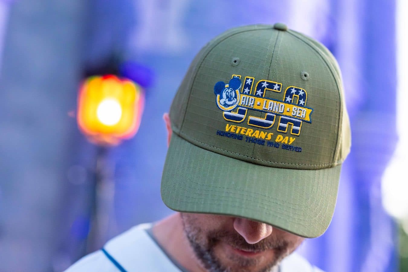 Disney's 2026 Veterans Day merchandise collection with Mickey Mouse on a Spirit Jersey, T-shirt, baseball cap and mug