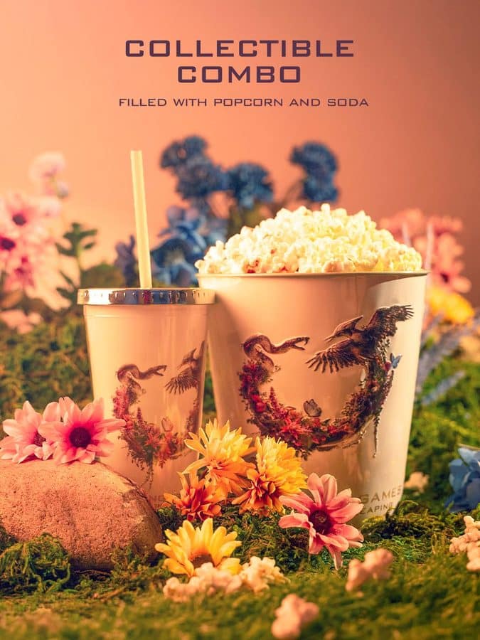 Two ornate cupsone with a strawfilled with popcorn and a drink placed among bright flowers in a garden setting with the words COLLECTIBLE COMBO above