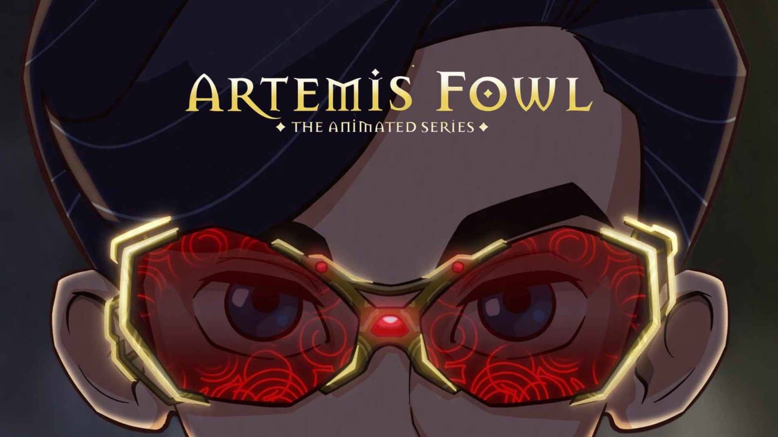 Close up of a character wearing ornate glowing red goggles with gold trim and the title Artemis Fowl across the top The animated series subtitle is visible as well