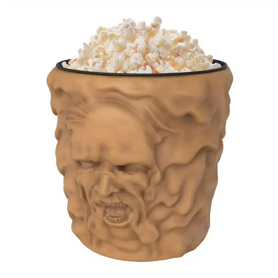 Head shaped ceramic mug with popcorn piled on top resembling a brain surface in warm brown tones