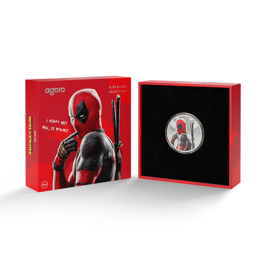 Deadpool themed collectible box set left packaging shows Deadpool with swords right display case holds a circular coin featuring Deadpool