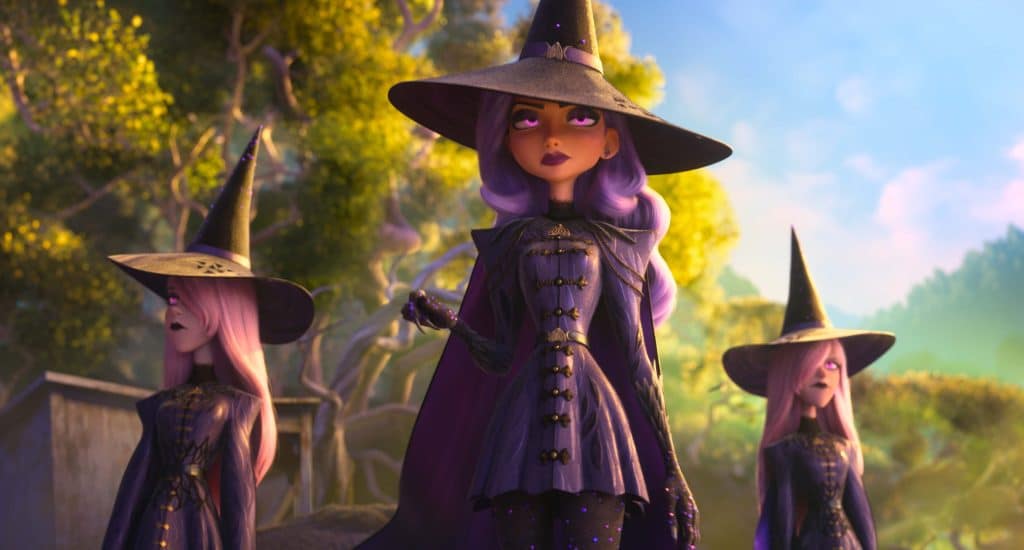 Three animated witches in purple dresses and pointed hats stand in a sunlit forest