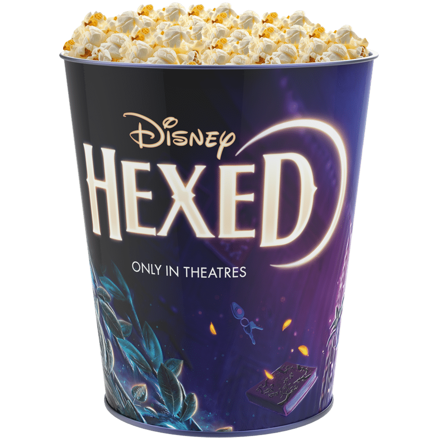 Purple Disney popcorn bucket filled with popcorn showing the Disney logo and the phrase Only in theatres on the side set against a simple background