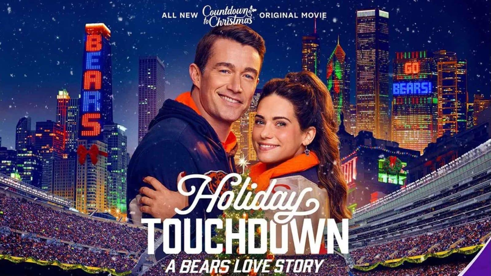 Couple embraces on a snowy city stadium backdrop for the movie Holiday Touchdown A Bears Love Story