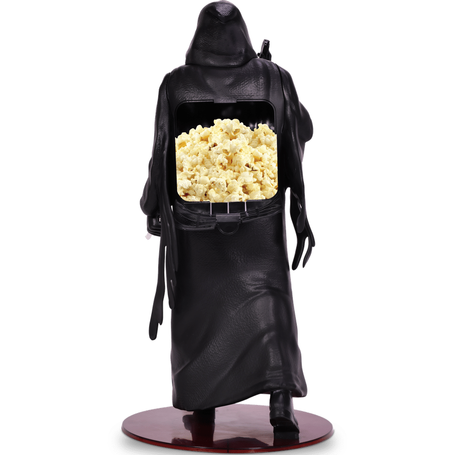 Back view of a black leather plague doctor statue with popcorn filling its open chest cavity and standing on a round wooden base